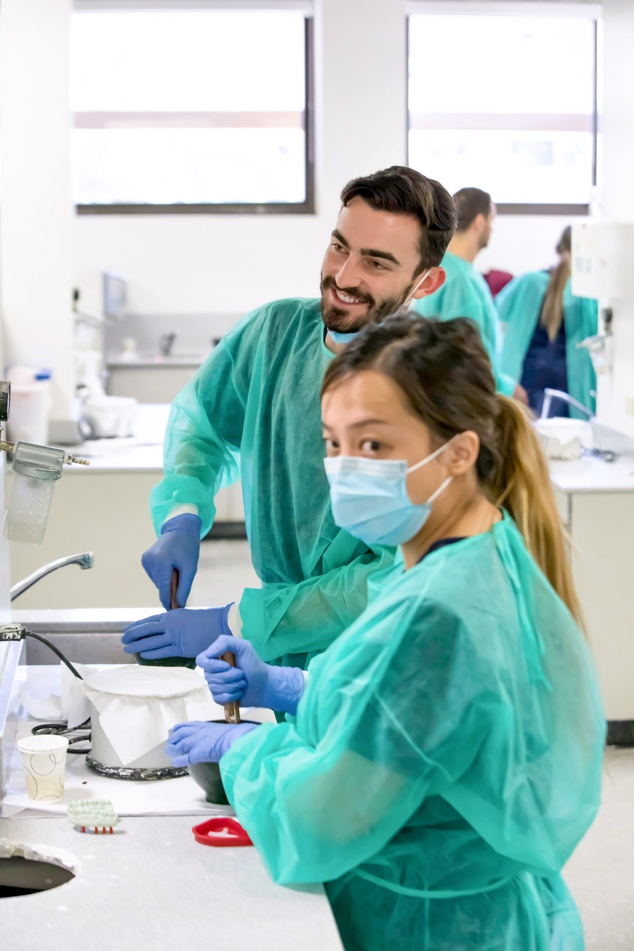 <em>Left:</em> USC DDS students mix dental stone to create dental models. <em>Right:</em> Periodontal osseous surgery exercise.  | NATE JENSEN