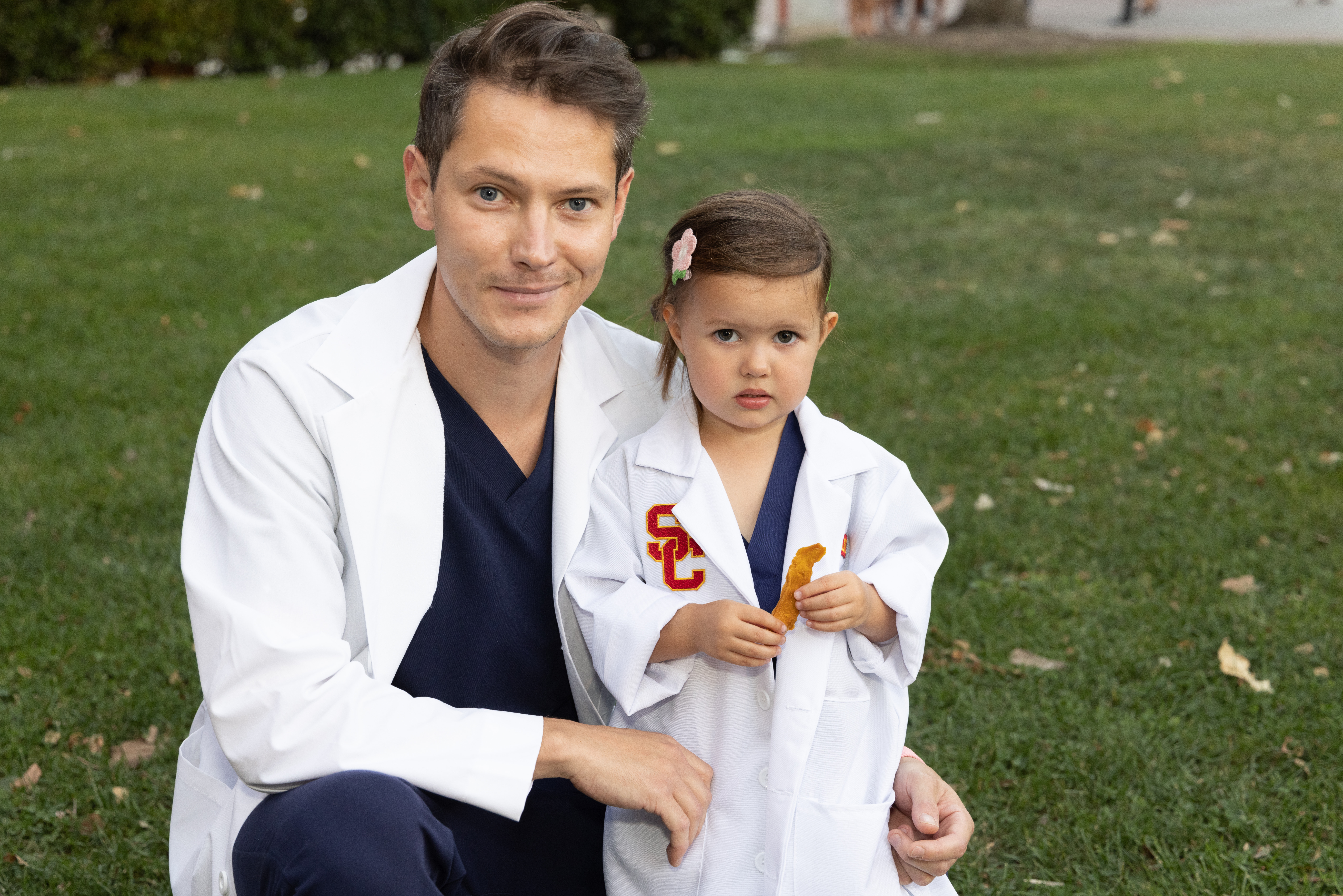 Artem Cheshkhov and his daughter at White Coat Ceremony