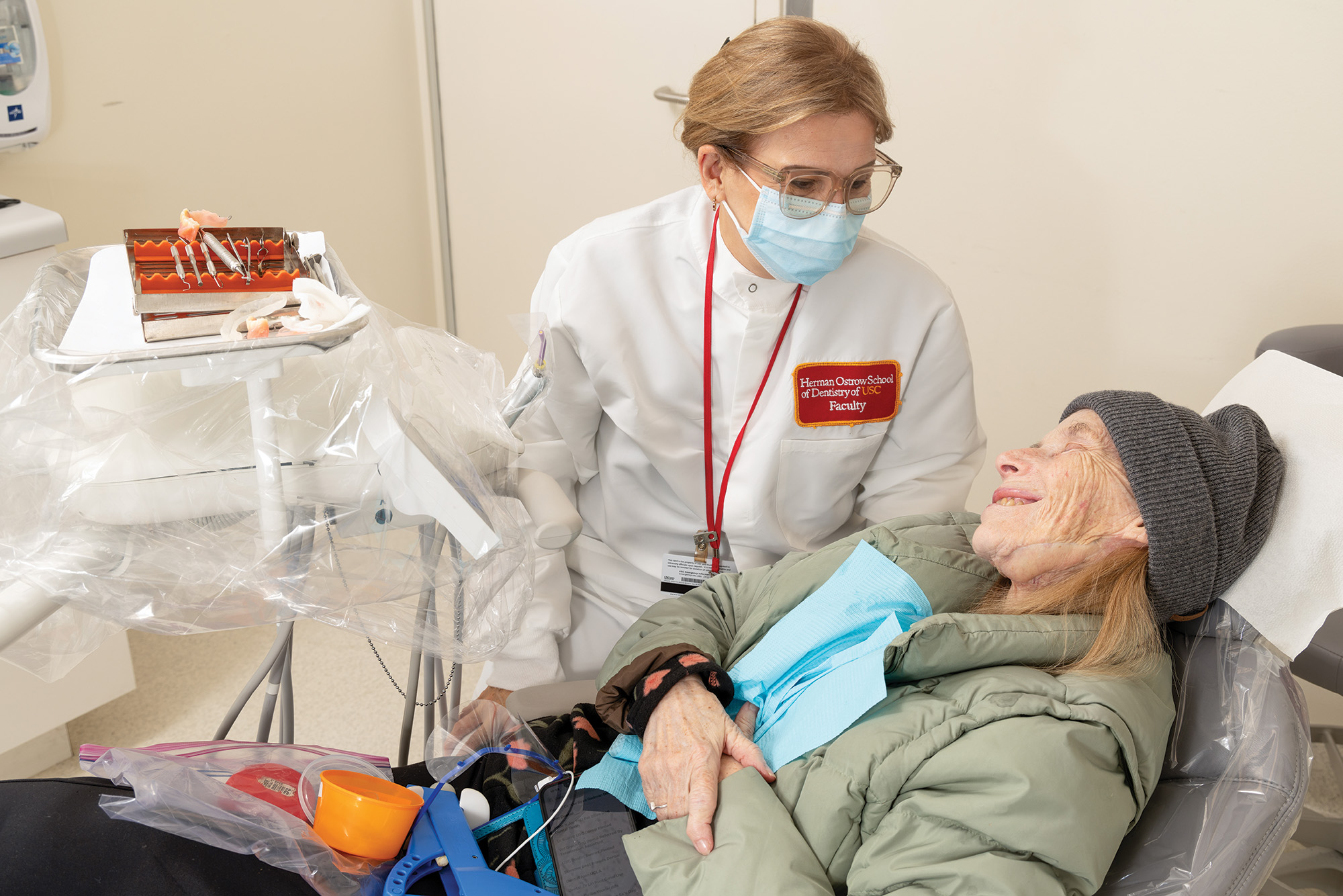 Piedad Suarez treats Karen McGuire at the Dr. Roseann Mulligan Special Patients Clinic.